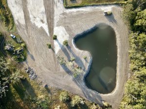 A drone aerial view picture of a pond Mackbuild excavated